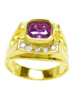 Men's 18K yellow gold ring with a bezel-set cushion-cut purplish-pink sapphire and diamond accents.