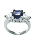 14K white gold cushion cut deep blue sapphire ring with trillion side sapphires.