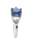 Women's cushion cut sapphire ring trillion side white sapphires 14k white gold, tilted top view side stone and shank profile