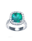 A women's natural colombian emerald ring cushion cut with halo natural diamond crafted in 14k white gold.