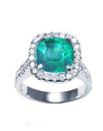 Front position, top view of a Women's emerald ring cushion cut with halo natural diamond crafted in 14k white gold.