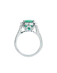Cushion cut 3.92 ct. deep bluish-green natural emerald ring with diamond halo in 14K white gold.