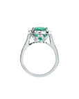 Cushion cut 3.92 ct. deep bluish-green natural emerald ring with diamond halo in 14K white gold.