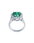 Cushion cut 3.92 ct. natural deep bluish green emerald ring with diamond halo in 14K white gold.