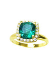 A natural cushion cut colombian emerald ring for women with halo diamond crafted in 14k yellow gold.