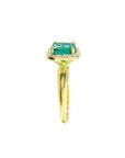 1.45 ct natural cushion-cut emerald ring with diamond halo in 14K gold.