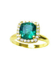 A natural cushion cut colombian emerald ring for women with halo diamond crafted in 14k yellow gold.