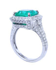 A complete profile of its downside view of a 18k white gold emerald ring cushion cut.