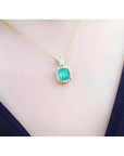 1.99 ct cushion-cut emerald pendant with halo natural diamonds on a 14K yellow gold chain.
