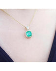 1.99 ct cushion-cut emerald pendant with halo natural diamonds on a 14K yellow gold chain.