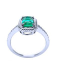 A real Colombian emerald ring from Muzo mines on a white background