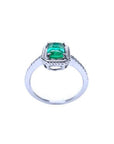 14K white gold cushion-cut emerald solitaire ring with distinctive rope detailing.