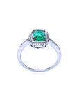 14K white gold cushion-cut emerald solitaire ring with distinctive rope detailing.