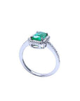 14K white gold solitaire ring with a cushion-cut emerald and rope detailing.