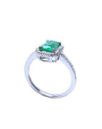 14K white gold solitaire ring with a cushion-cut emerald and rope detailing.