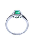 The top setting. gallery and band displayed in this cushion cut natural emerald ring in white gold.