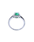 14K white gold cushion-cut emerald solitaire ring with rope detailing.
