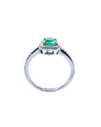 14K white gold cushion-cut emerald solitaire ring with rope detailing.