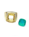 18k yellow gold men's ring setting with diamond accents next to a loose cushion-cut emerald.