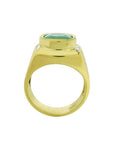 Men's 18k yellow gold ring with a cushion-cut emerald and diamond accents.
