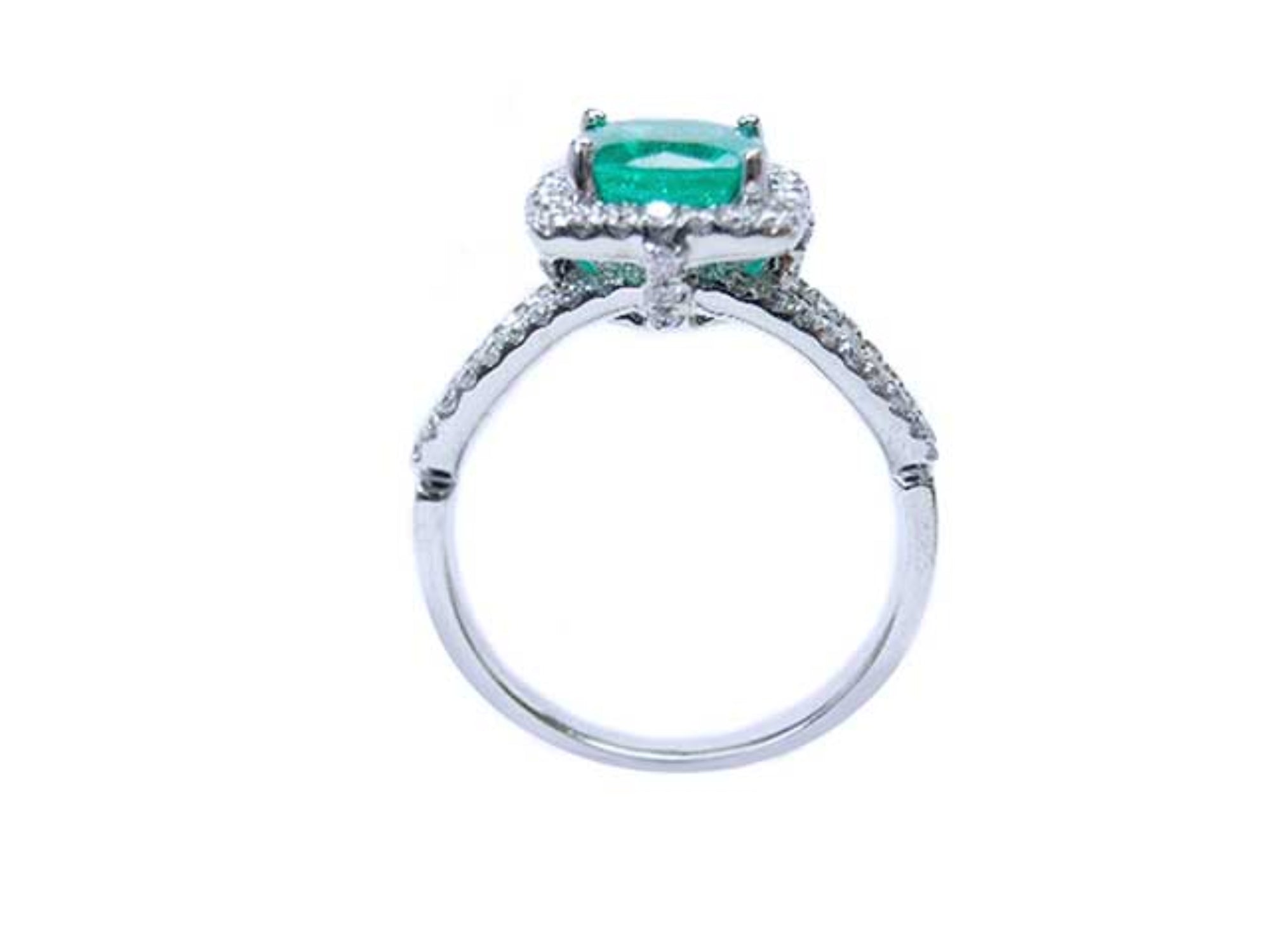 The lateral side of this colombian emerald ring displays the top setting, gallery and band ring.