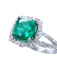 A cushion cut with halo diamond ring in white gold, stone topside and split shank profile displayed.