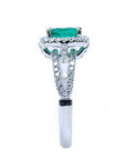 Side profile in this white gold emerald ring, where the top setting, gallery, split shank and ring band are more visibles.