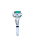Side profile in this white gold emerald ring, where the top setting, gallery, split shank and ring band are more visibles.