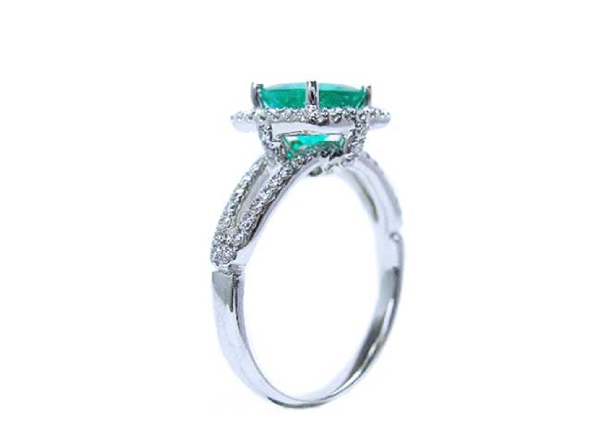 This underside vista in this emerald ring shows the top setting, gallery and split shank with band.