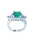 2.18 ct cushion cut Colombian emerald ring with trillion side diamonds in 14K white gold.