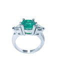 2.18 ct cushion cut Colombian emerald ring with trillion side diamonds in 14K white gold.