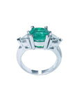 2.18 ct cushion cut Colombian emerald ring with trillion side diamonds in 14K white gold.