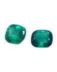 Matching pair cushion cut loose colombian emeralds front left side table and crown view