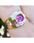 A natural, GIA-certified, untreated men’s pink sapphire ring featuring a radiant purplish-pink hue, beautifully bezel-set in 18k yellow gold.