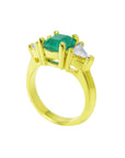1.47 ct. emerald-cut Colombian emerald ring with trillion diamonds in 18k yellow gold.