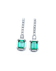 Pair of natural emerald dangle earrings with diamond accents in 18k white gold, front side top view