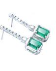 Pair of emerald earrings right side profile top and gallery view in white gold