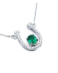 Genuine emerald horseshoe necklace with natural diamonds, crafted in 14k white gold, a lucky piece of jewelry to wear every day