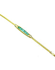 14K yellow gold bracelet with five emerald-cut Colombian emeralds.