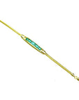 14K yellow gold bracelet with five emerald-cut Colombian emeralds.