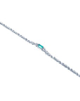14K white gold bracelet with a rectangular Muzo Colombian emerald and diamond accents.