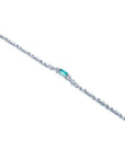 14K white gold bracelet with a rectangular Muzo Colombian emerald and diamond accents.