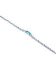 14K white gold bracelet with a rectangular Muzo Colombian emerald and diamond accents.