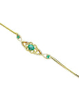 Vintage 14K yellow gold bracelet with oval emeralds and natural diamonds.