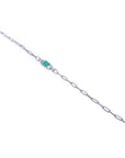 14K white gold paper clip bracelet with a bluish-green emerald and diamond halo.