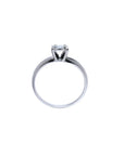 Round cut diamond solitaire engagement ring in 14K white gold with an illusion setting.