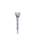 Round cut diamond solitaire engagement ring in 14K white gold with an illusion setting.