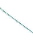 Colombian emerald tennis bracelet with round cut green emeralds in 14K white gold.