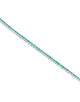 Colombian emerald tennis bracelet with round cut green emeralds in 14K white gold.