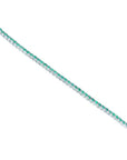 Colombian emerald tennis bracelet with round cut green emeralds in 14K white gold.